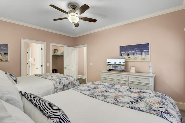 bedroom with ceiling fan, a closet, a spacious closet, and ornamental molding