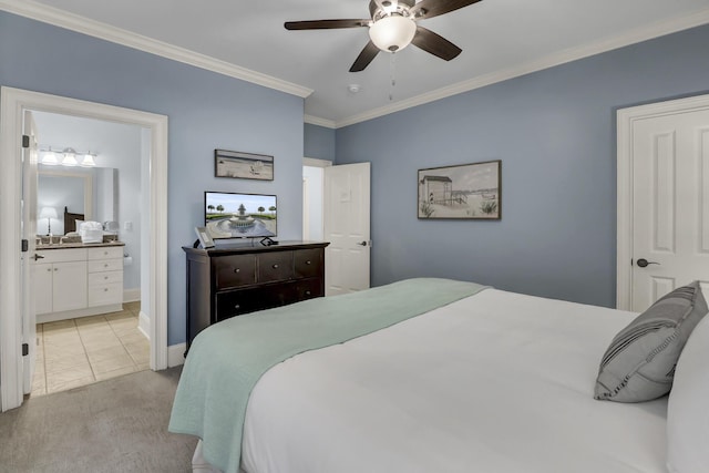 carpeted bedroom featuring ceiling fan, crown molding, and ensuite bathroom