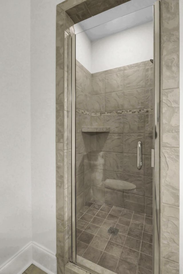 bathroom with a shower with shower door