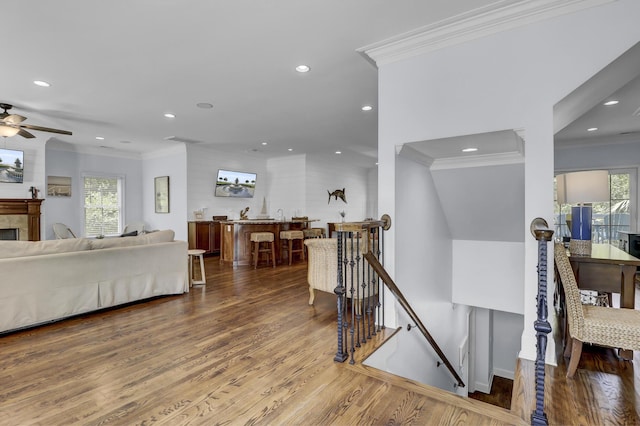 interior space featuring hardwood / wood-style flooring and ornamental molding