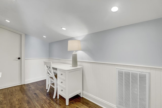 office space with dark hardwood / wood-style flooring