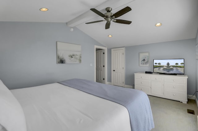 carpeted bedroom with lofted ceiling with beams and ceiling fan