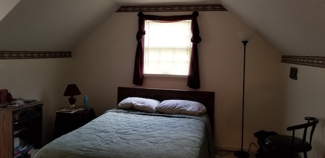 bedroom with lofted ceiling