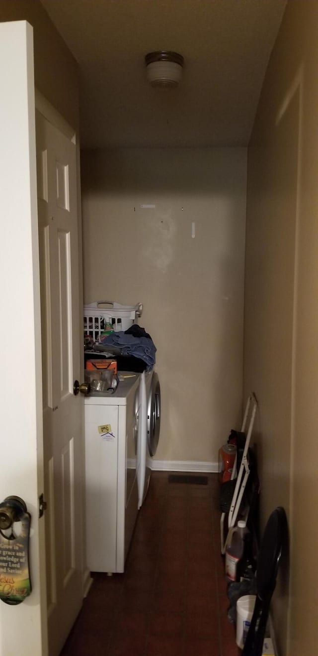 laundry room with washer and dryer