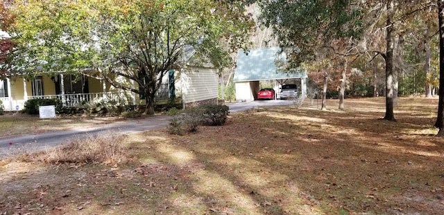 view of front of property with a carport and covered porch