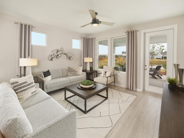 living room with ceiling fan and light hardwood / wood-style floors