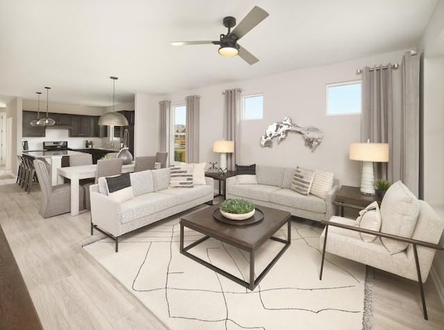 living room featuring ceiling fan and light hardwood / wood-style floors