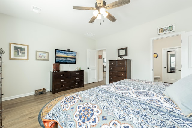 bedroom with ceiling fan and light hardwood / wood-style floors