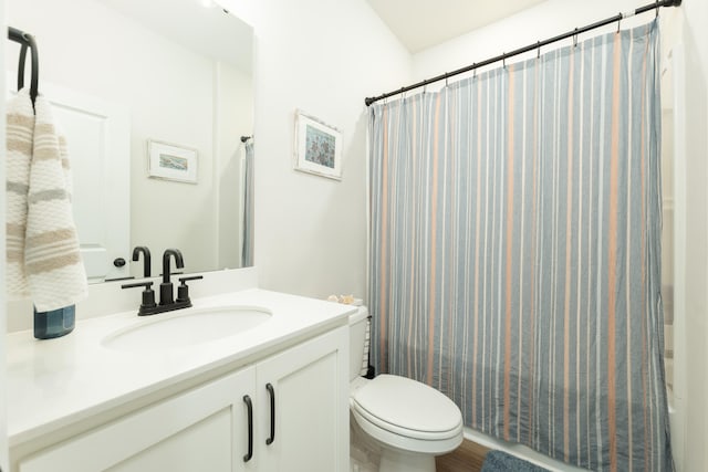 bathroom with walk in shower, vanity, toilet, and hardwood / wood-style flooring