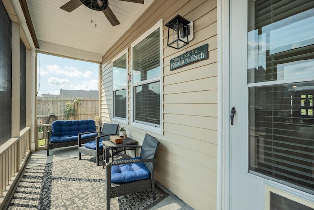 sunroom / solarium featuring ceiling fan and wooden ceiling