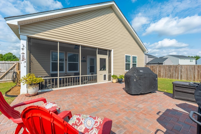 view of patio / terrace with area for grilling and a sunroom