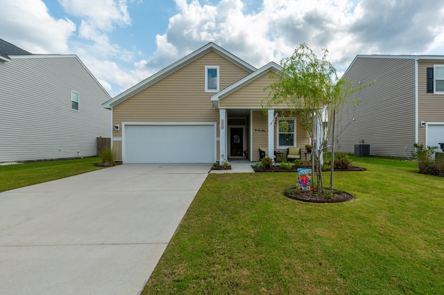 view of front of property with a garage and a front lawn