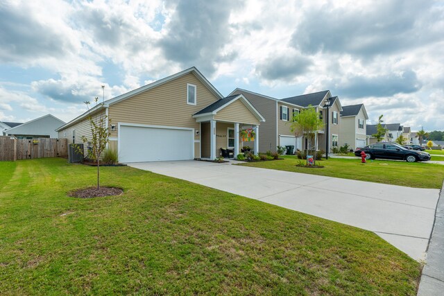 view of front of house featuring a garage, central AC unit, and a front yard