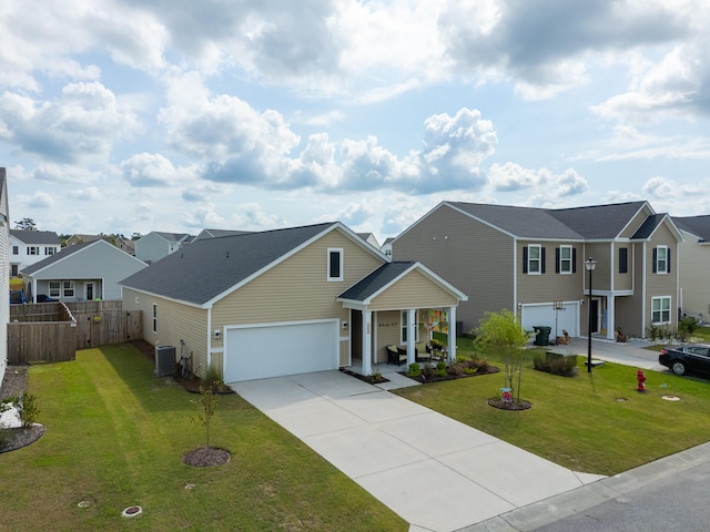 view of front of property with cooling unit, a front yard, and a garage