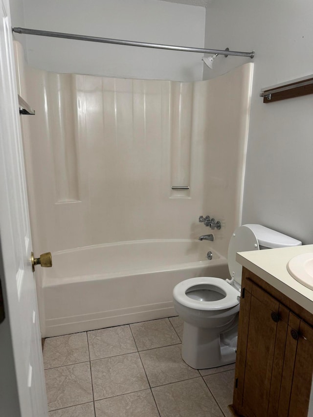 full bathroom with tile patterned floors, toilet, vanity, and tub / shower combination