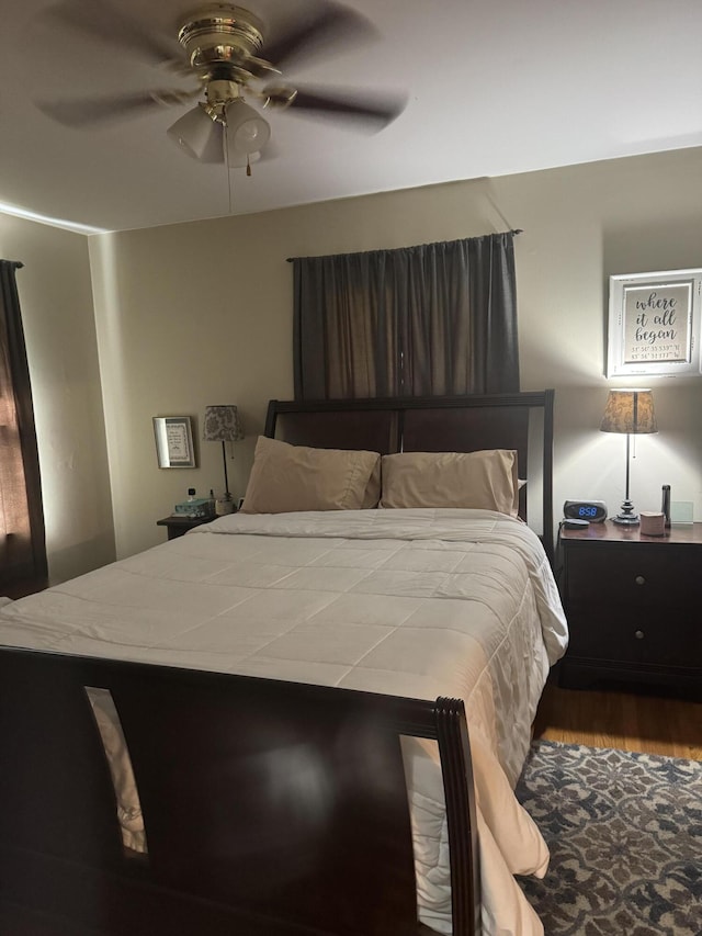 bedroom featuring wood finished floors and ceiling fan