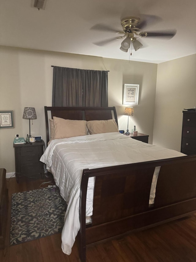 bedroom with wood finished floors and ceiling fan