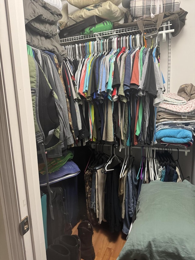 spacious closet featuring wood finished floors