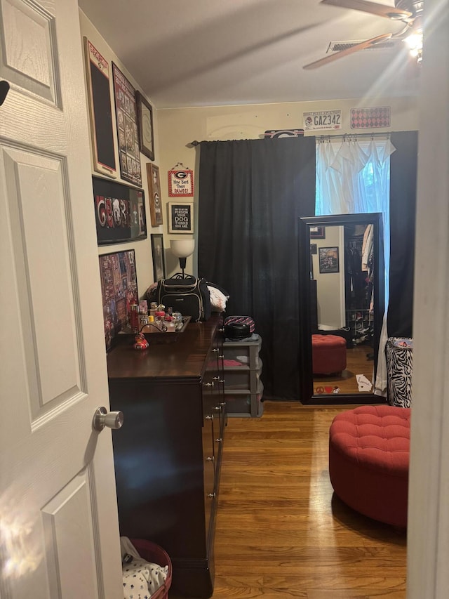 office area featuring a ceiling fan and wood finished floors