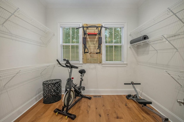 workout area featuring hardwood / wood-style floors