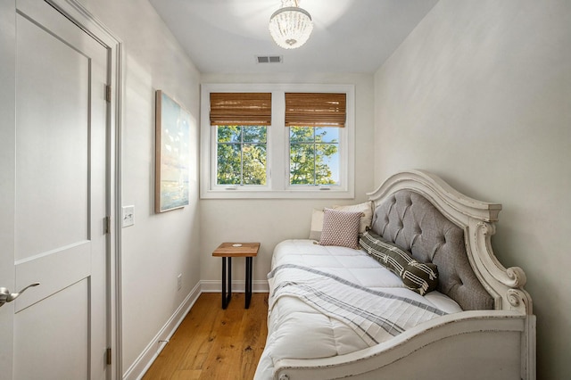 bedroom with hardwood / wood-style floors