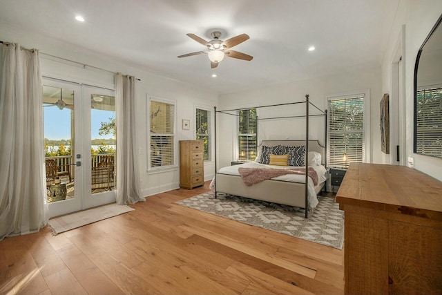 bedroom with ceiling fan, access to outside, light wood-type flooring, and french doors