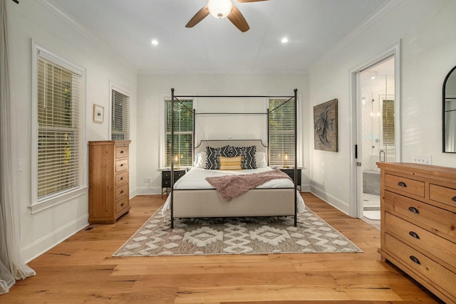 bedroom featuring crown molding, ceiling fan, ensuite bath, and light hardwood / wood-style flooring