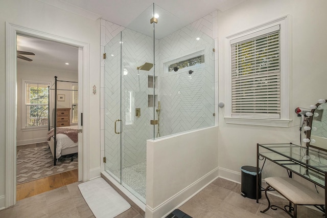 bathroom with a shower with door