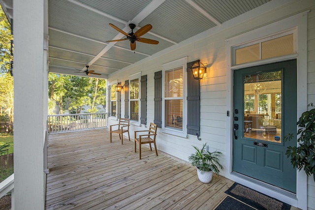 wooden terrace featuring ceiling fan and covered porch