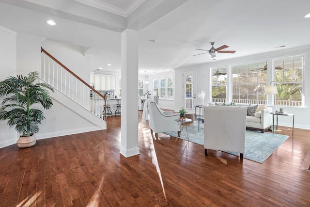 living room with ceiling fan, dark hardwood / wood-style floors, and ornamental molding