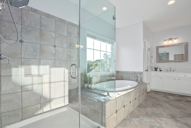 bathroom featuring vanity, separate shower and tub, and tile patterned floors