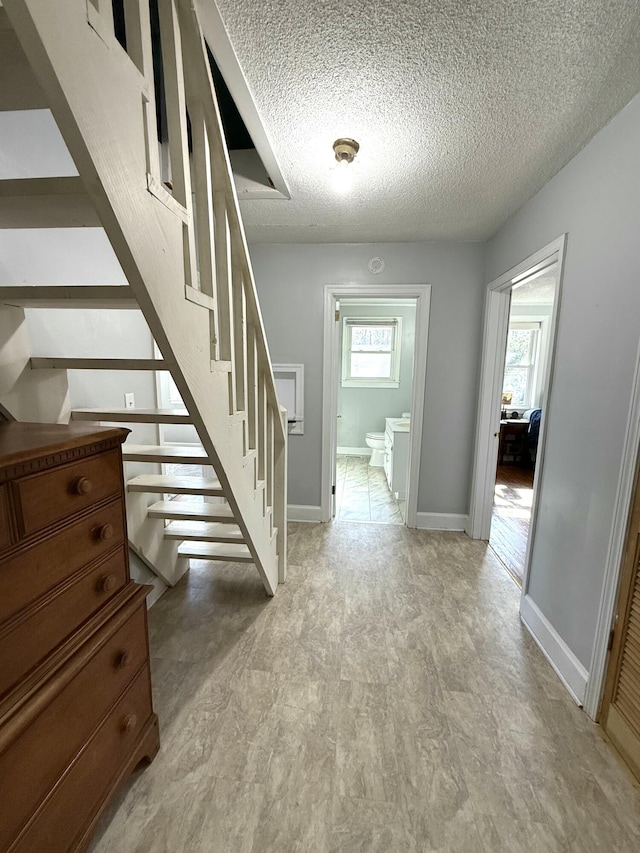 interior space with a textured ceiling