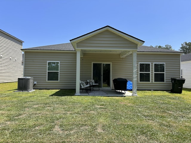 305 Camellia Bloom Dr, Moncks Corner, SC 29461 - rear view of house with central AC, a yard, a patio area, and a shingled roof