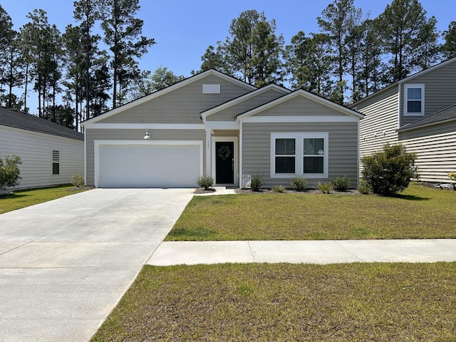 305 Camellia Bloom Dr, Moncks Corner, SC 29461 - view of front facade featuring a garage, driveway, and a front lawn