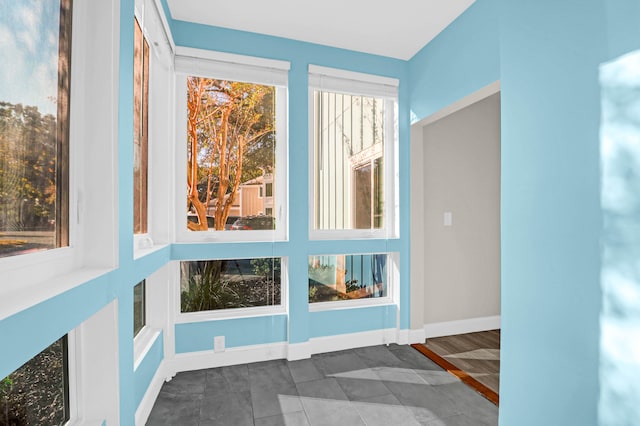 unfurnished sunroom with a healthy amount of sunlight