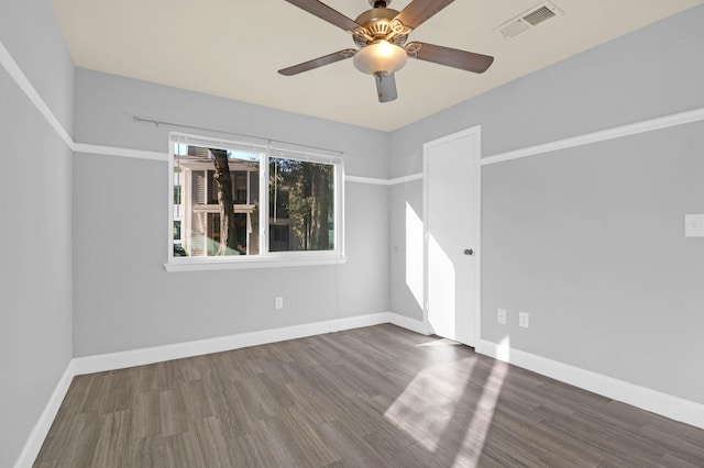 empty room featuring hardwood / wood-style flooring and ceiling fan