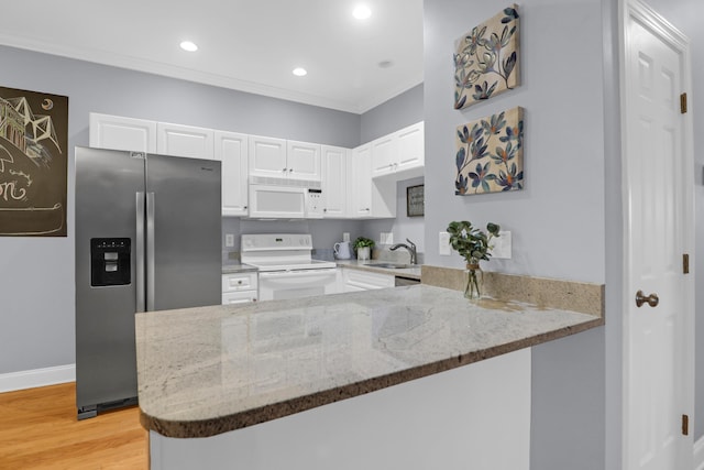 4003 Radcliffe Place Dr Unit B6, Charleston, SC 29414 - kitchen featuring white appliances, light stone counters, white cabinetry, a peninsula, and a sink