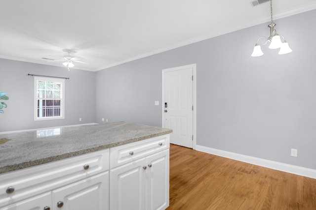 4003 Radcliffe Place Dr Unit B6, Charleston, SC 29414 - kitchen with a chandelier, ceiling fan, white cabinets, light wood-style flooring, and crown molding