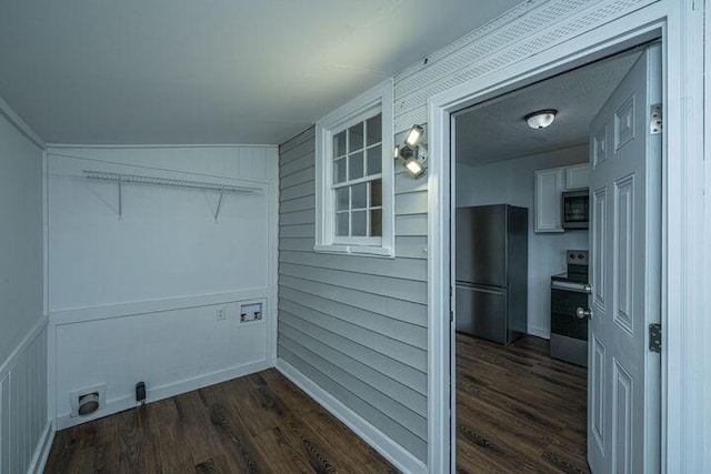 washroom featuring dark wood-style flooring and laundry area