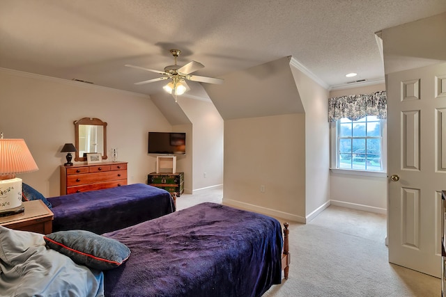 carpeted bedroom with ceiling fan, lofted ceiling, a textured ceiling, and ornamental molding