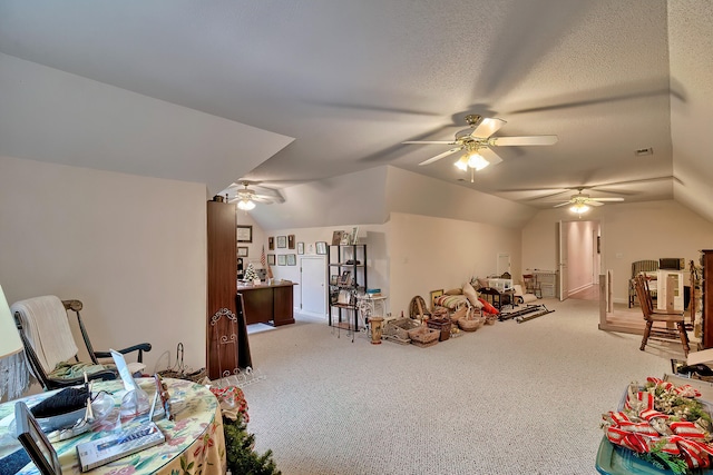 interior space featuring carpet flooring, a textured ceiling, ceiling fan, and lofted ceiling