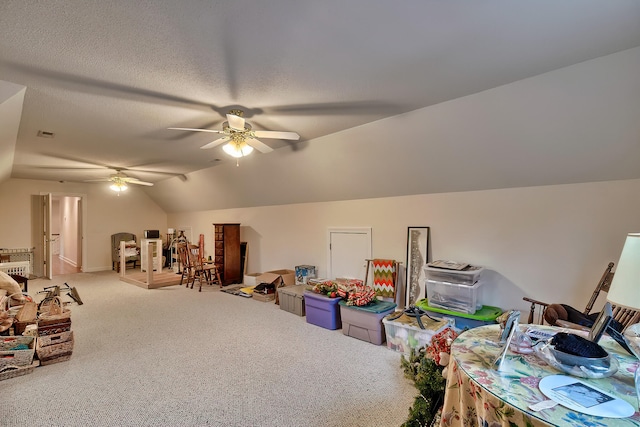 game room featuring carpet flooring, ceiling fan, and lofted ceiling