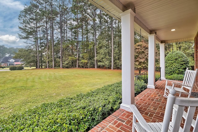 view of yard with covered porch