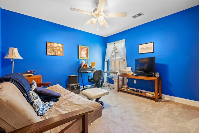 interior space with ceiling fan, visible vents, and baseboards
