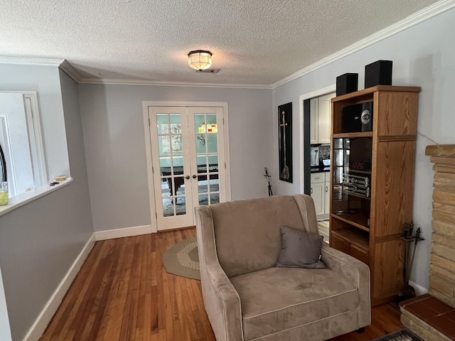 111 Newington Rd, Summerville, SC 29485 - sitting room featuring french doors, ornamental molding, a textured ceiling, wood finished floors, and baseboards