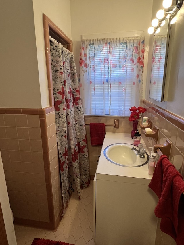 111 Newington Rd, Summerville, SC 29485 - full bathroom with vanity, tile walls, and wainscoting