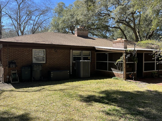 111 Newington Rd, Summerville, SC 29485 - back of house with a sunroom, brick siding, a yard, and a chimney