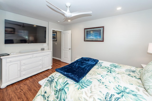 bedroom with ceiling fan and dark wood-type flooring