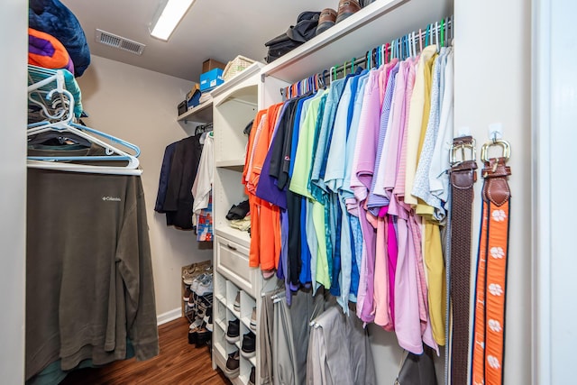 spacious closet featuring dark wood-type flooring