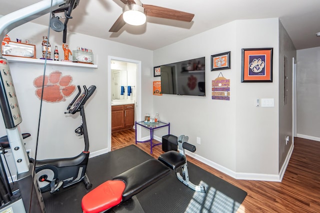 workout room with ceiling fan and hardwood / wood-style floors